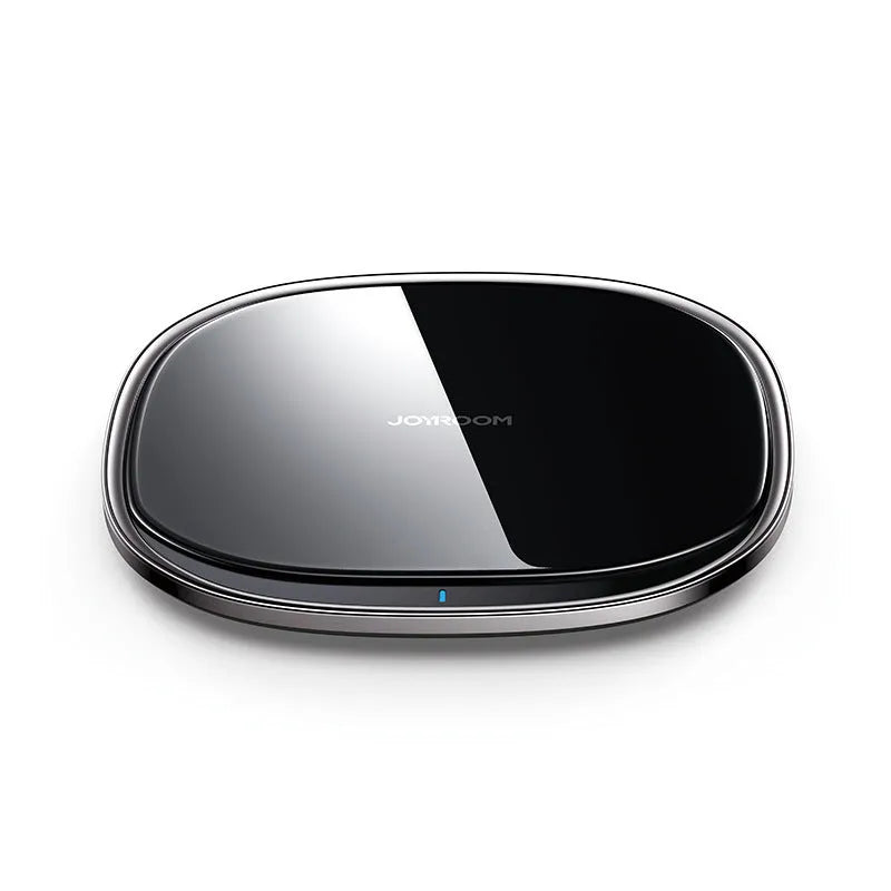 Black 15W square wireless charging pad with a glass top on a desk