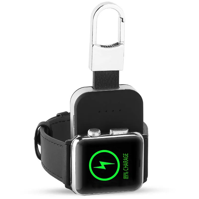 Black ABS Apple Watch wireless charging power bank on a keyring, shown next to an Apple Watch.