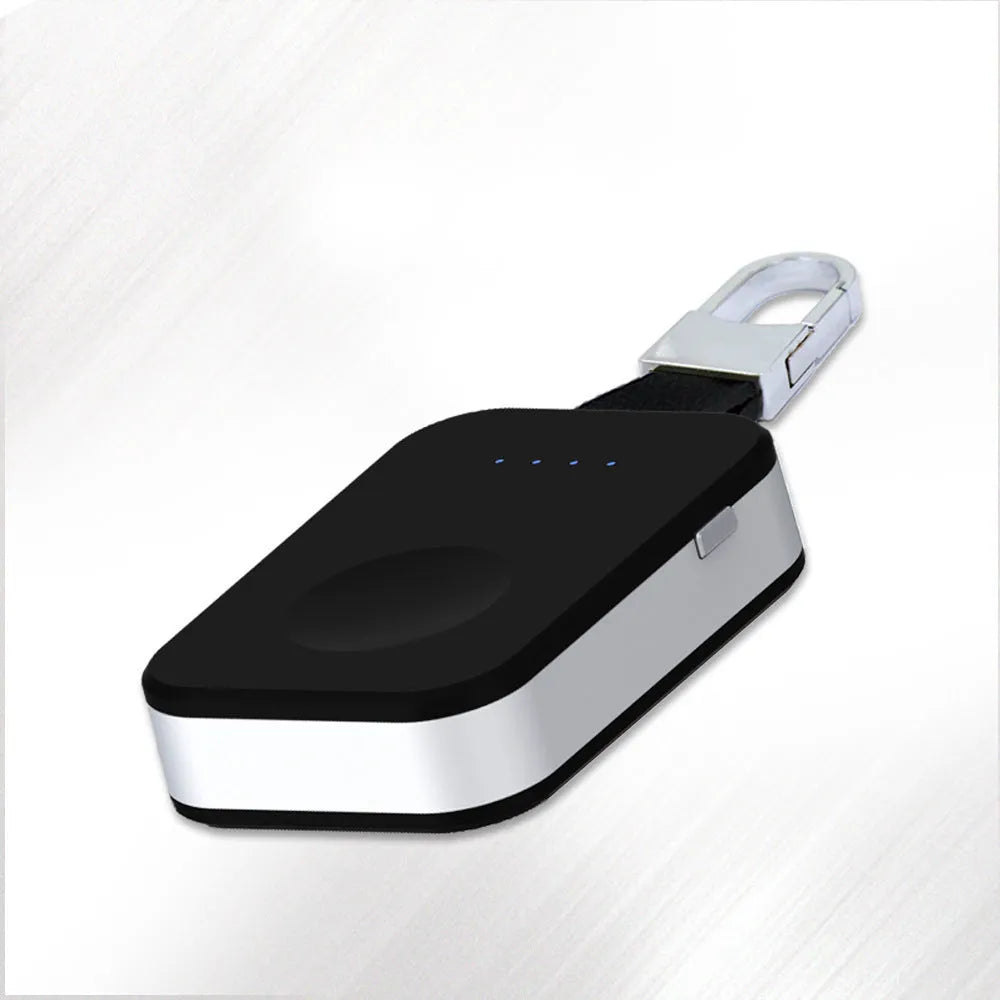 Black ABS Apple Watch wireless charging power bank on a keyring, shown next to an Apple Watch.