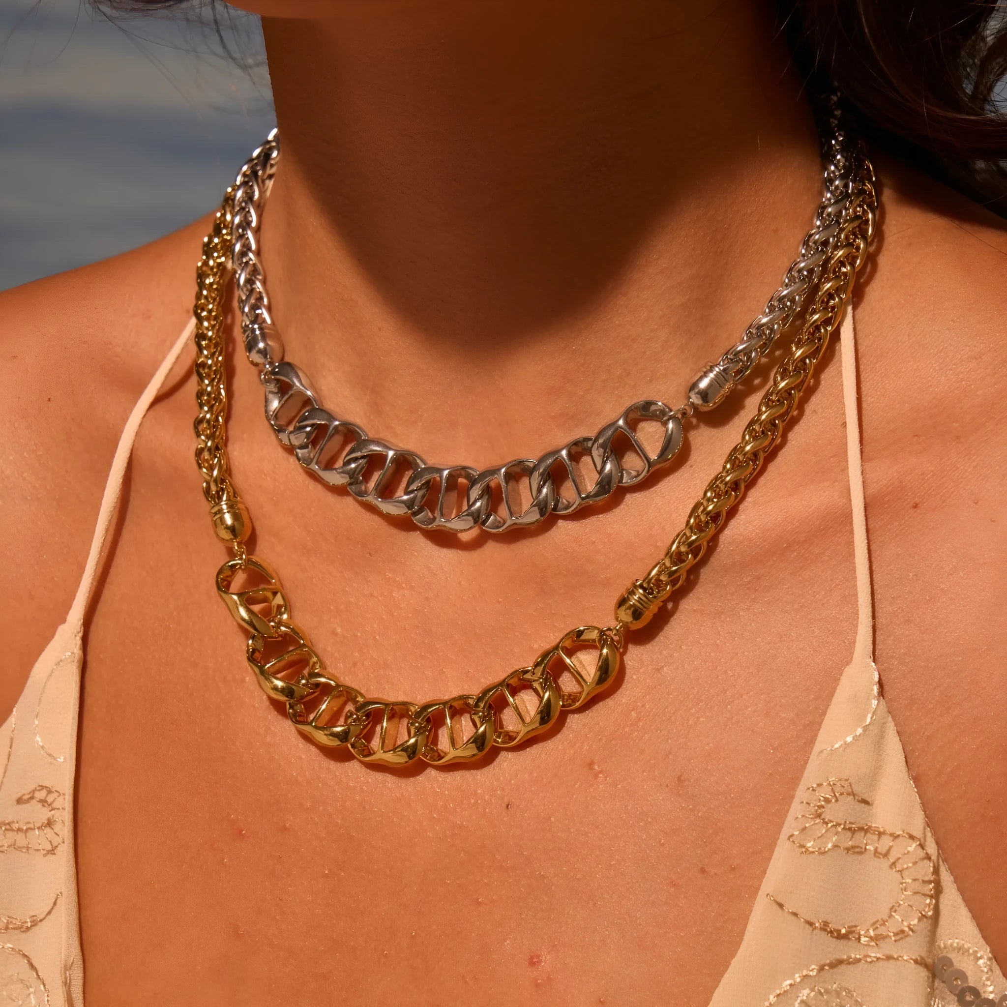Stainless steel geometric necklace with 18K gold plating in gold and steel colour options