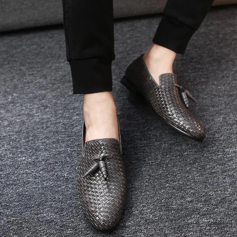Anyaman men's woven loafers in black with soft sole, side view showing handcrafted weave texture
