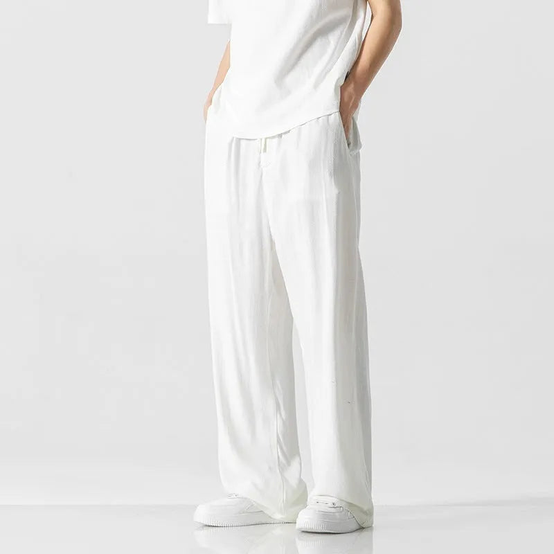 Men's linen trousers in straight-leg cut with cropped length and drawstring waist in beige colour