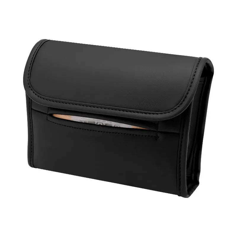 Brown leather car tissue box with elastic strap hanging on a car armrest