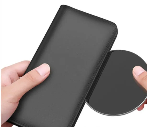 Ultra-thin aluminum wireless charger in silver colour showing charging indicator light