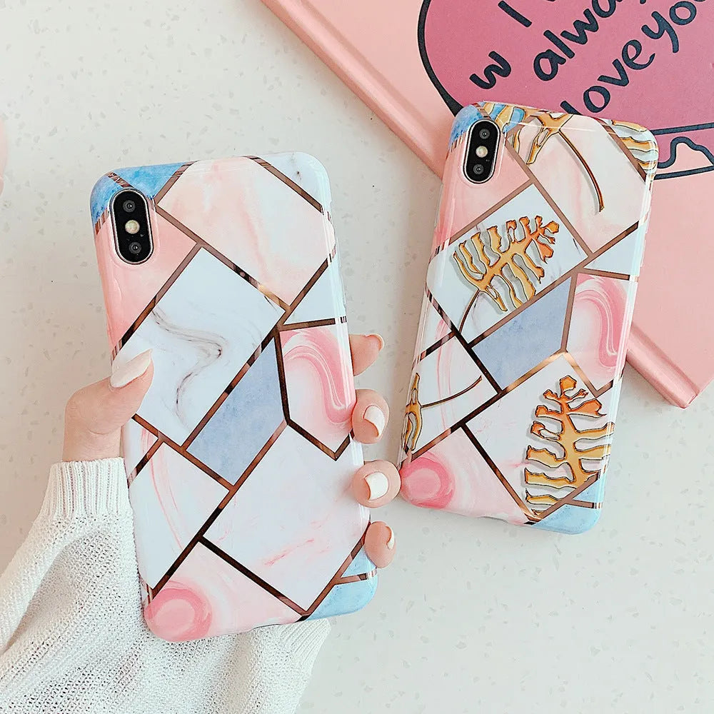 Flexible silicone mobile phone case for various iPhone models on a table.