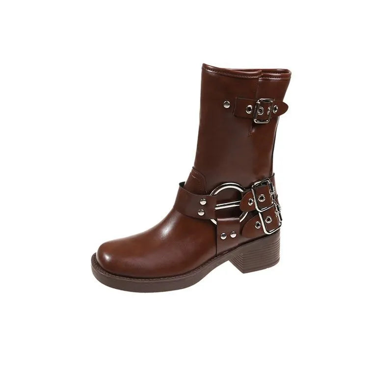 Women's black platform boots with buckle decoration at mid-calf height on a neutral background