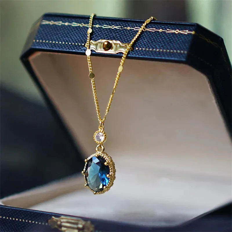 Gold geometric pendant necklace on chain with French retro design