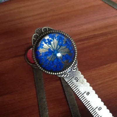 Handmade dried flower ruler bookmark with gypsophila, daffodil, lace flower, and clover on 12cm base in multiple colours.