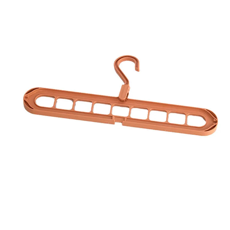 Multifunctional nine-hole plastic hanger for trousers and skirts in five colour options on a white background.