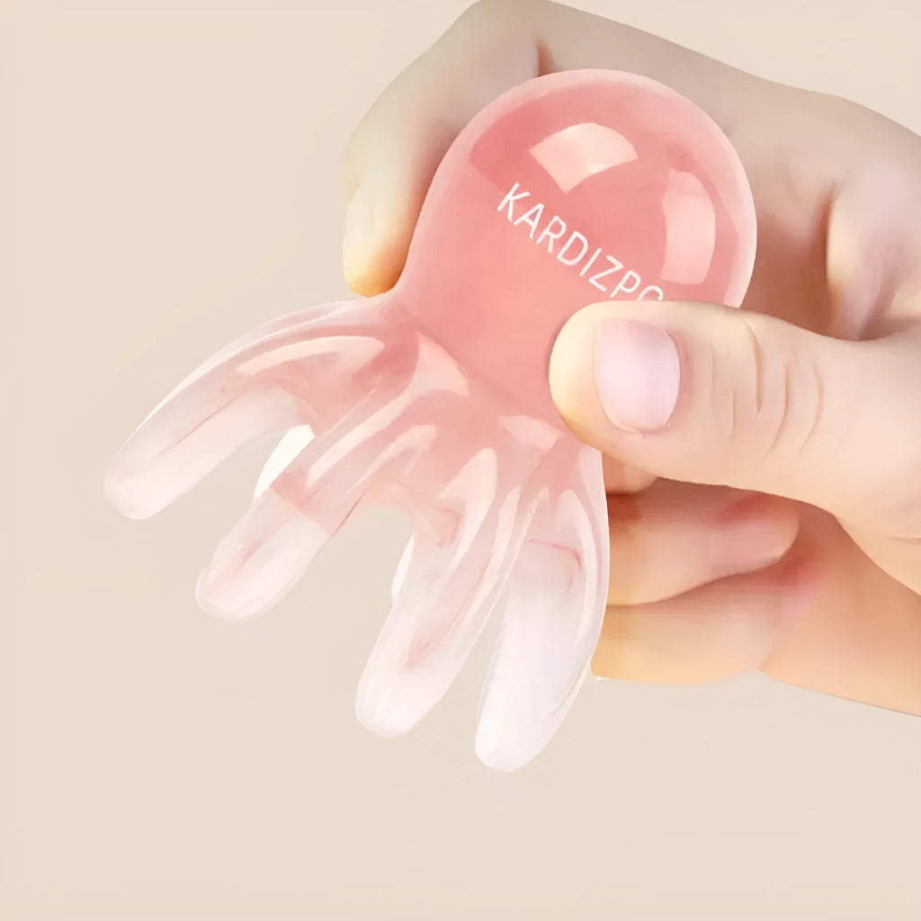 Pink octopus-shaped facial massage comb made from natural resin with storage bag