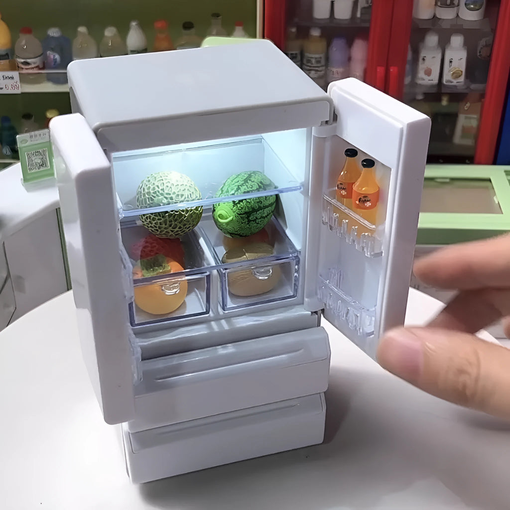White plastic miniature candy toy model with illuminated light function, shown on a desk.