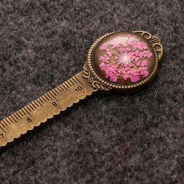 Handmade dried flower ruler bookmark with gypsophila, daffodil, lace flower, and clover on 12cm base in multiple colours.