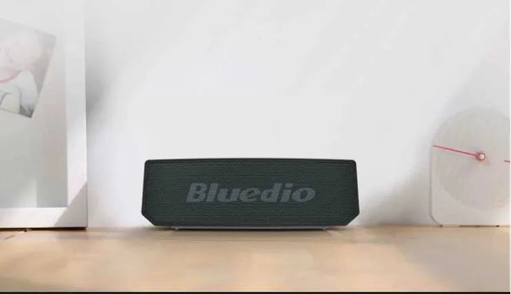 Black BS-6 Cloud Smart Speaker showing front grille and compact rectangular design