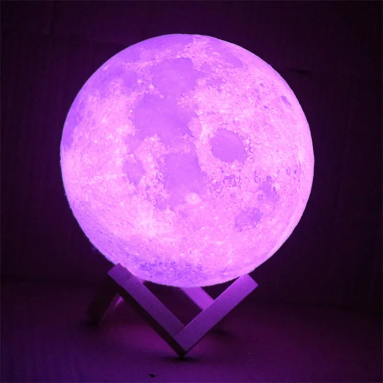 3D printed white moon lamp on a wooden stand with touch control ring at base