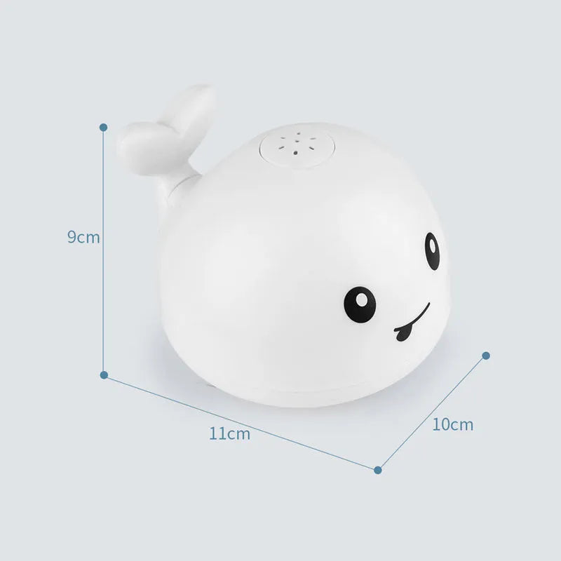 Automatic spray whale bath toy with LED lights floating in water
