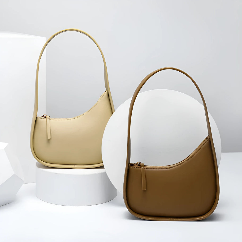 Small genuine leather half-moon women's shoulder bag with wide strap in four colour options