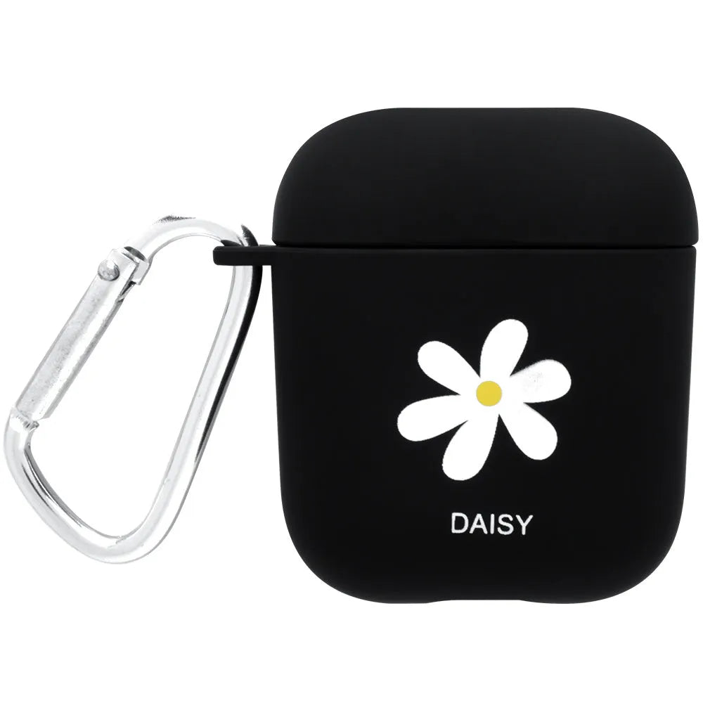 Black AirPods hard case with a smiley face design next to a pink case with a flower pattern.