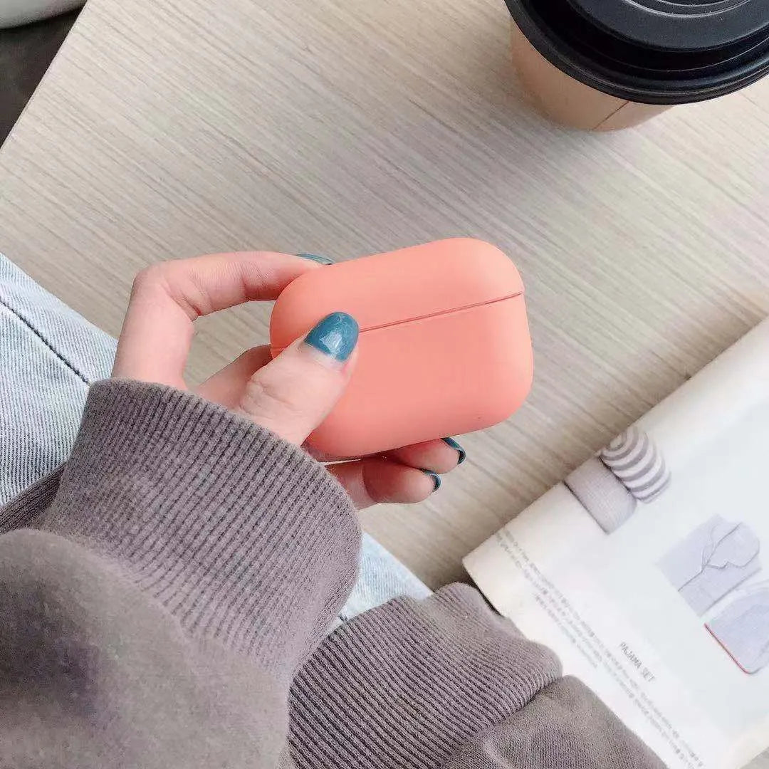 Plastic protective case for AirPods Pro headphones in various colours on a plain background