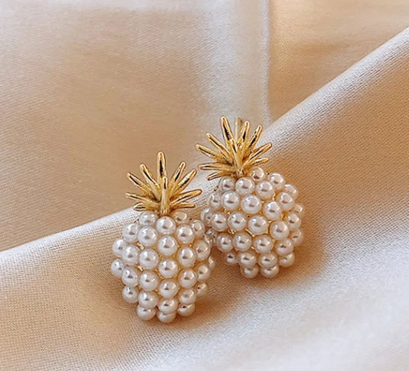 Korean-style pineapple starfish pearl earrings in electroplated alloy with decorative gemstones.