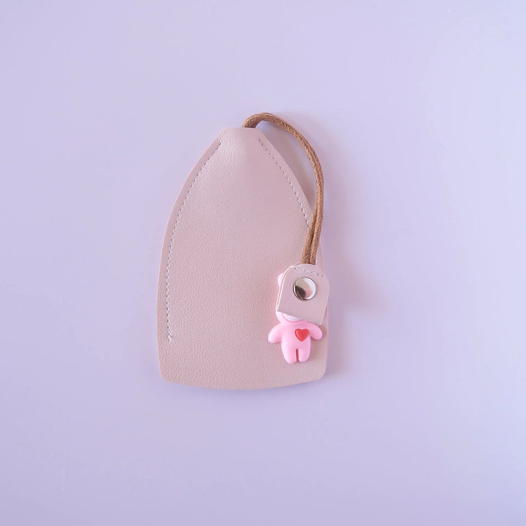 Pu material car key case organiser in black, shown holding keys and cards.