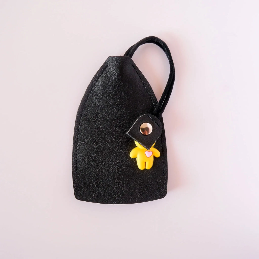 Pu material car key case organiser in black, shown holding keys and cards.