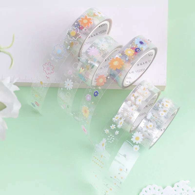 Five rolls of transparent decorative washi tape with Midsummer Daisy pattern, each 1.5cm wide