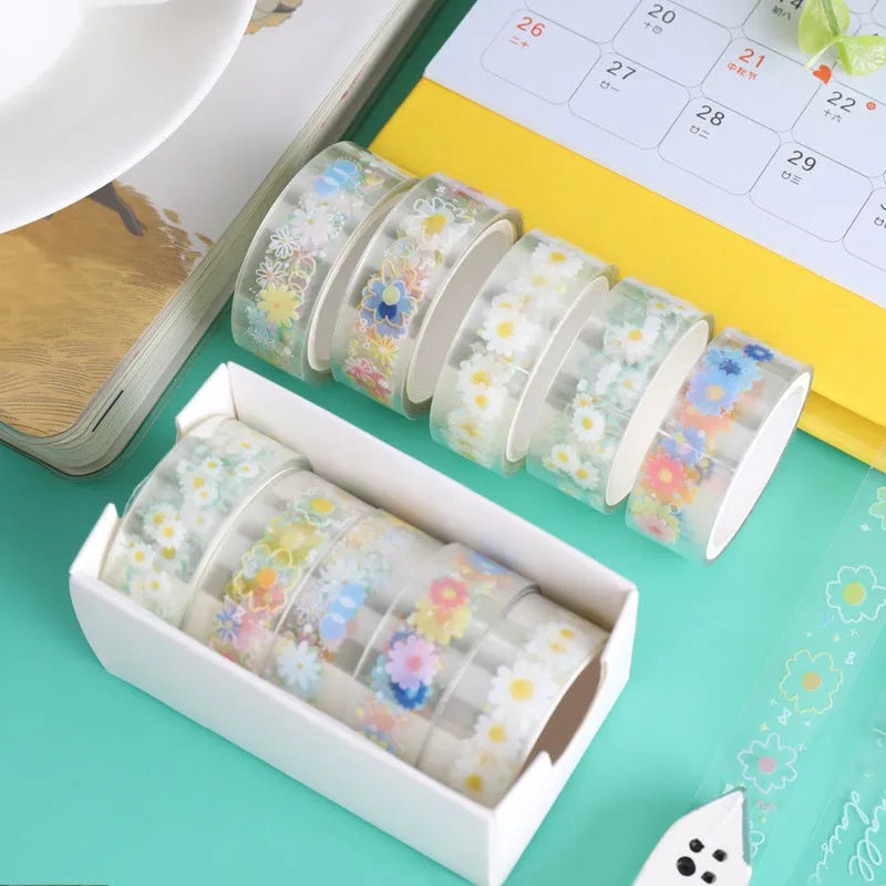 Five rolls of transparent decorative washi tape with Midsummer Daisy pattern, each 1.5cm wide