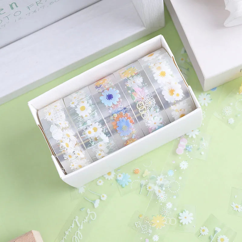 Five rolls of transparent decorative washi tape with Midsummer Daisy pattern, each 1.5cm wide