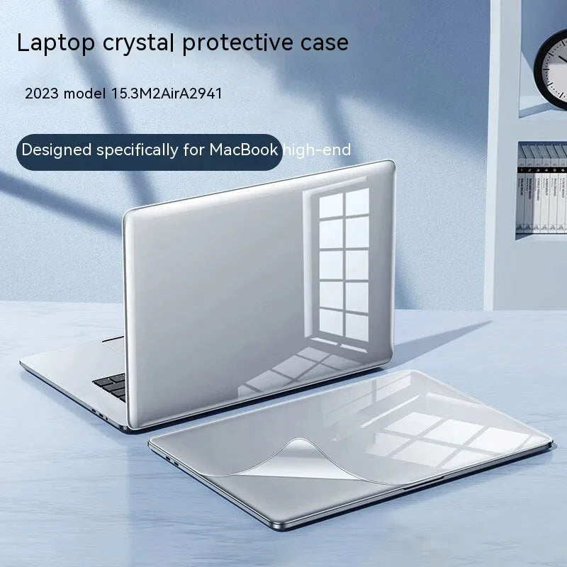 MacBook protective case in plastic shell, shown in crystal black and transparent options, fitted on a MacBook laptop