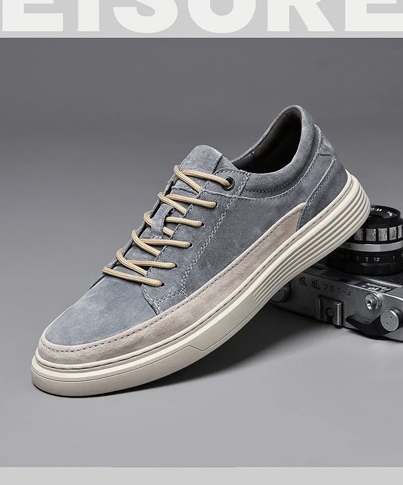 Men's grey casual skate shoes with pigskin upper and rubber sole on white background
