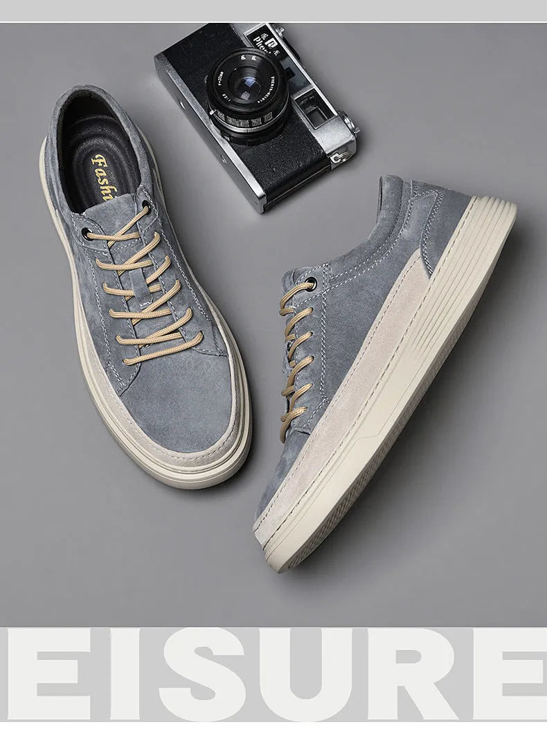 Men's grey casual skate shoes with pigskin upper and rubber sole on white background