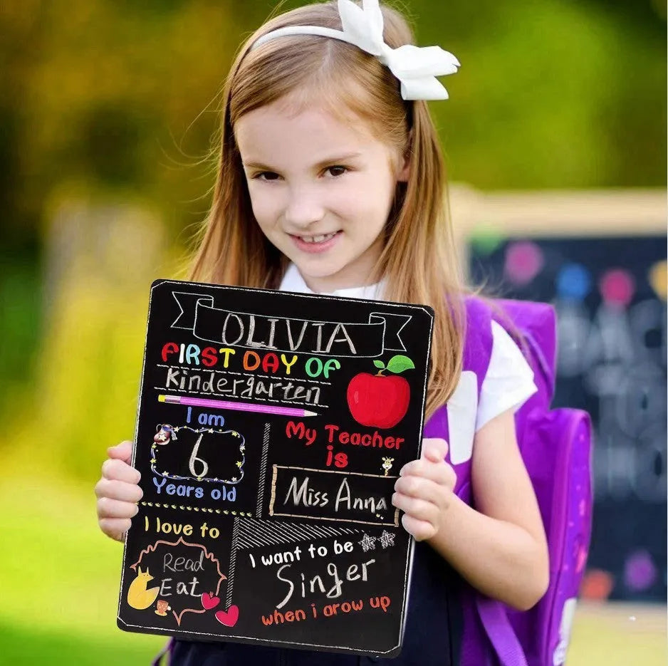Modern wooden first day of school blackboard sign with dimensions 25.5cm by 30cm.
