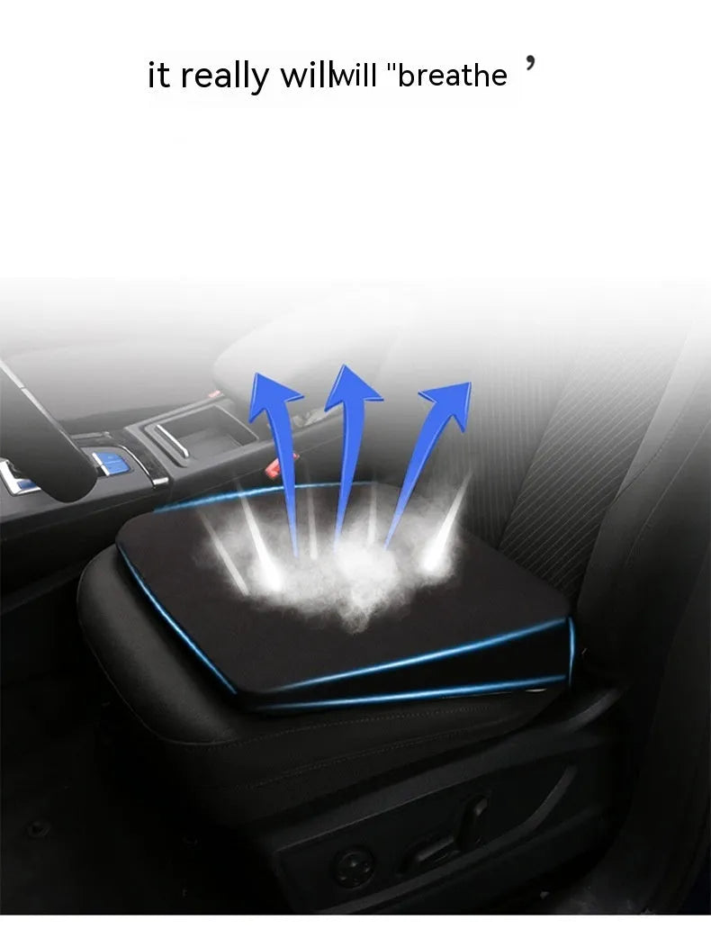 Black car seat cushion with thick foam padding, shown on a car seat.