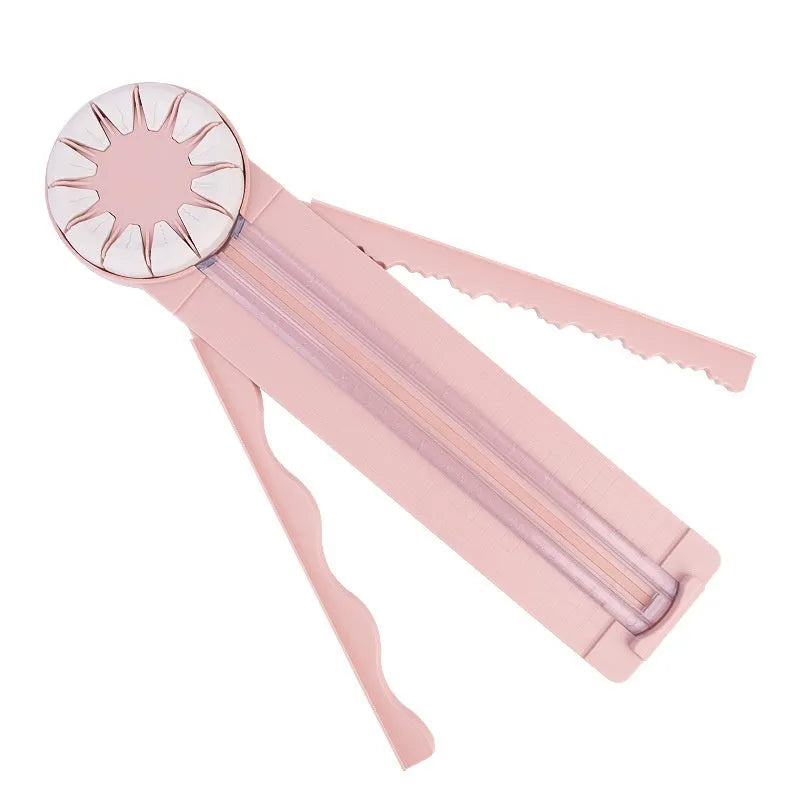 12-in-1 plastic paper cutting machine with dotted board in pink or black, measuring 46.2 cm long