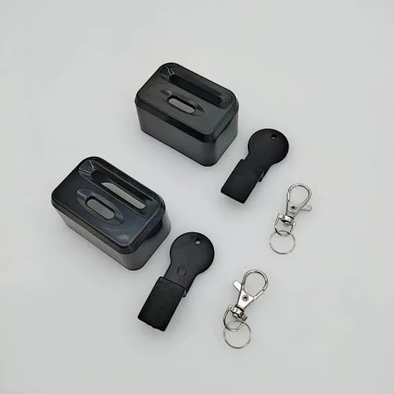 Black plastic seat belt buckle holder clip for car seat belt organisation