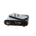 Silver aluminium audio source selector switch box with front button and infrared remote control.