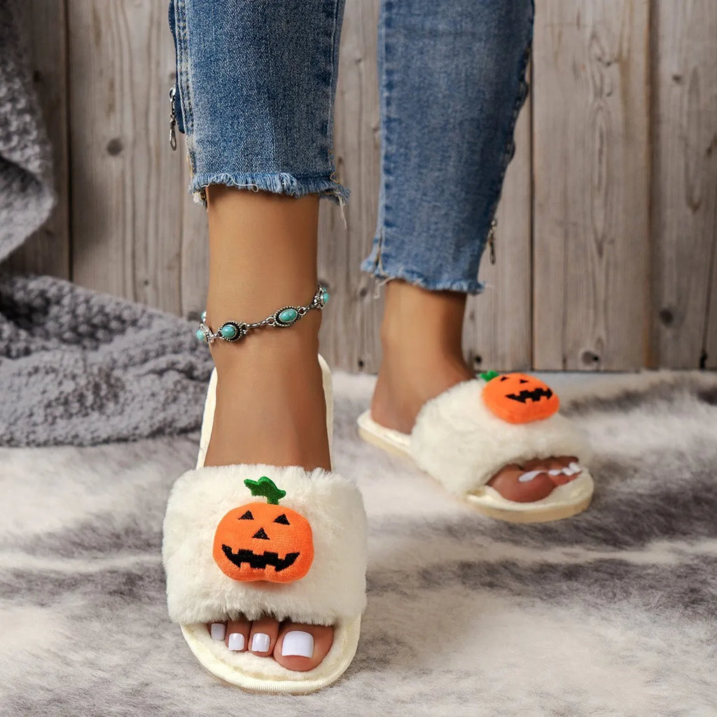 Halloween cartoon pumpkin design open-toe plush slippers on a white or yellow synthetic fur upper with PVC sole.
