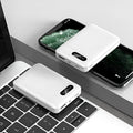 Black and white portable power bank showing compact rectangular design with USB ports