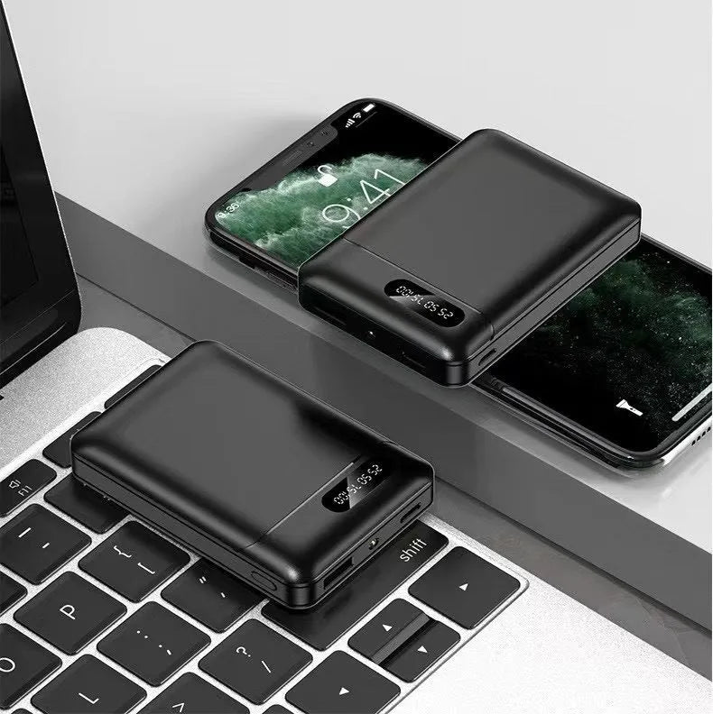 Black and white portable power bank showing compact rectangular design with USB ports