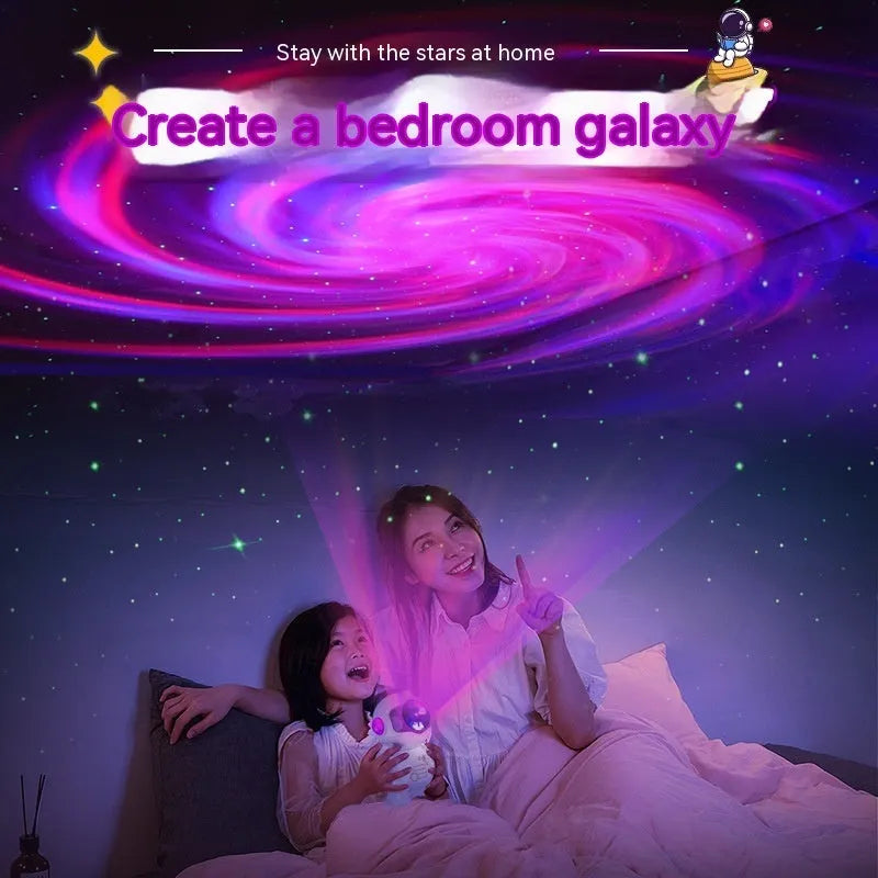 White astronaut starry sky projection lamp with 8 colour options and remote control on a shelf