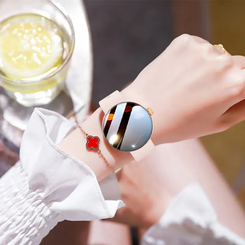 Women's smart watch with circular colour screen and metal wrist strap on wrist