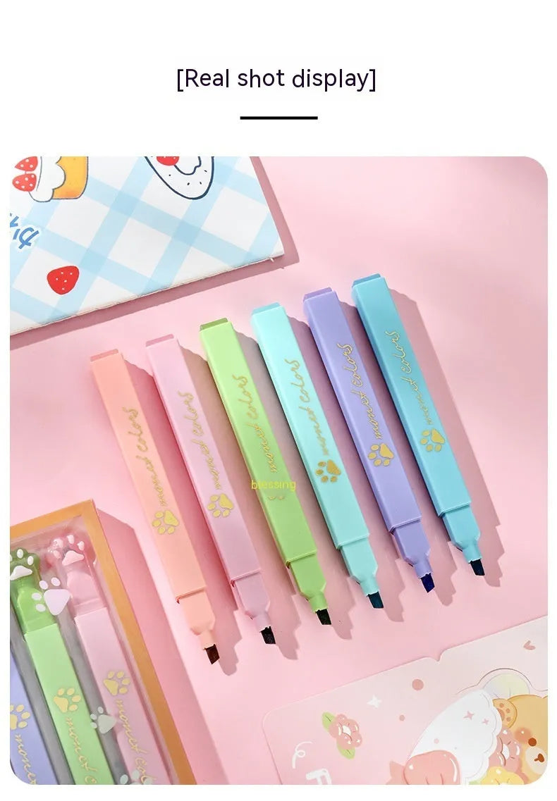 Box containing six Cat's Paw fluorescent marking pens with oblique nibs in assorted colours.