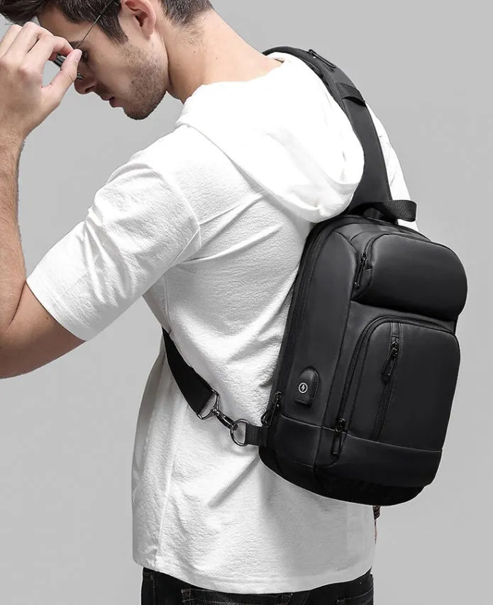 Black PVC outdoor leisure shoulder bag with air cushion strap and internal organiser pockets