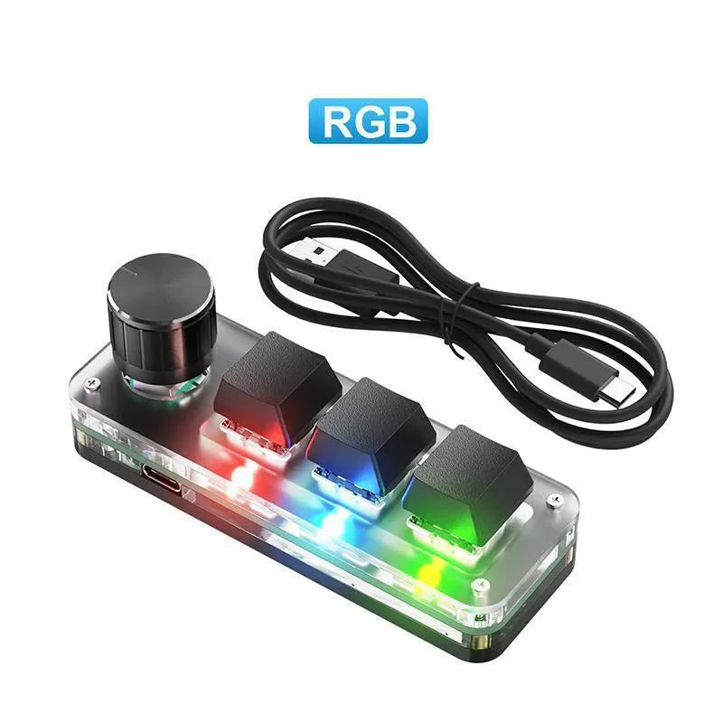 Black macro keypad with RGB backlit keys for copy paste commands beside USB cable