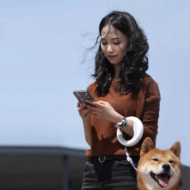 Automatic retractable dog leash with 3 metre rope, acrylic hand unit, leather chest strap, and seven colour options including fluorescent finishes