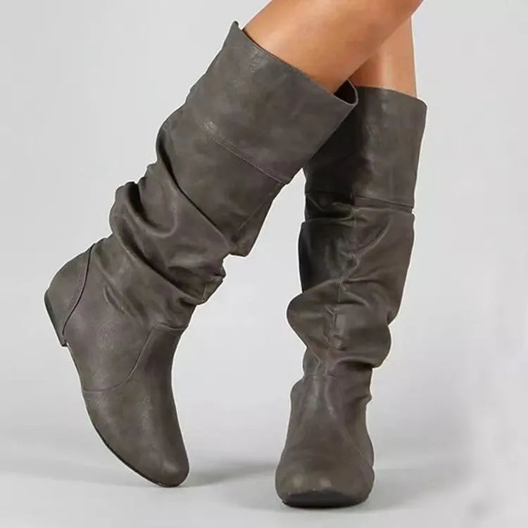 Women's flat heel long slip-on boots in black with round toe and high cylinder design