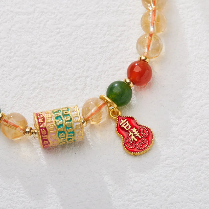 Hand-woven citrine crystal bracelet with 6mm geometric beads on a wrist