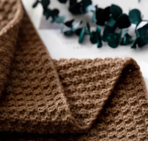 Nordic style fringed knit ball acrylic throw blanket in beige, laid flat showing 130x170cm size.