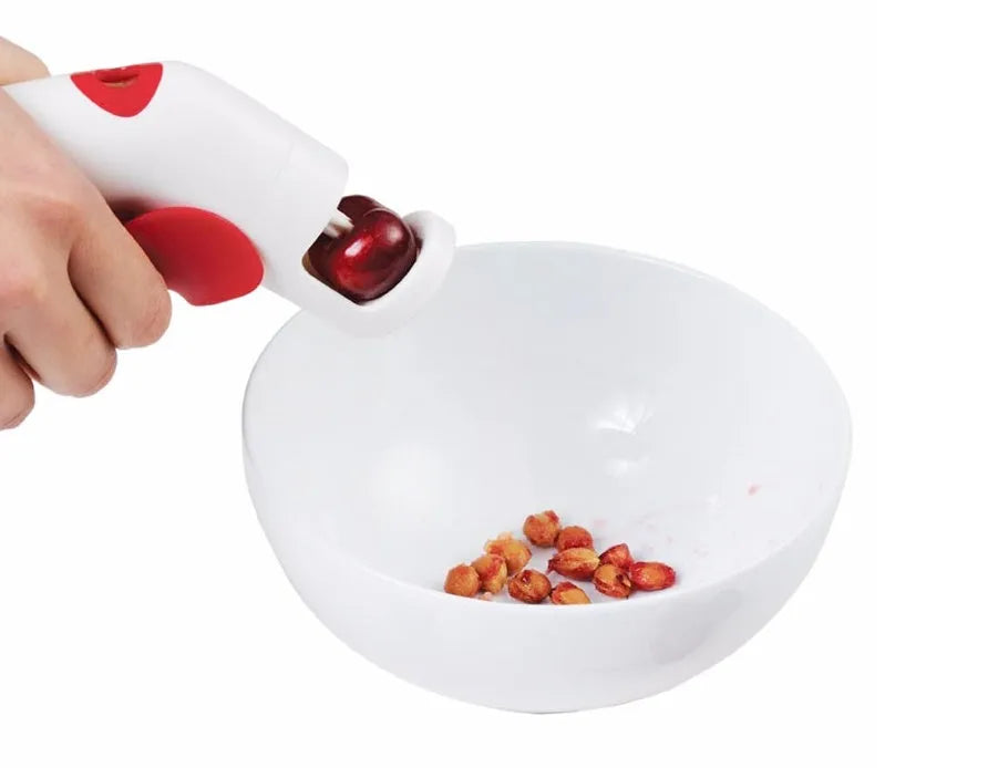 Manual cherry kernel remover kitchen tool with protective finger guard and stainless steel plunger