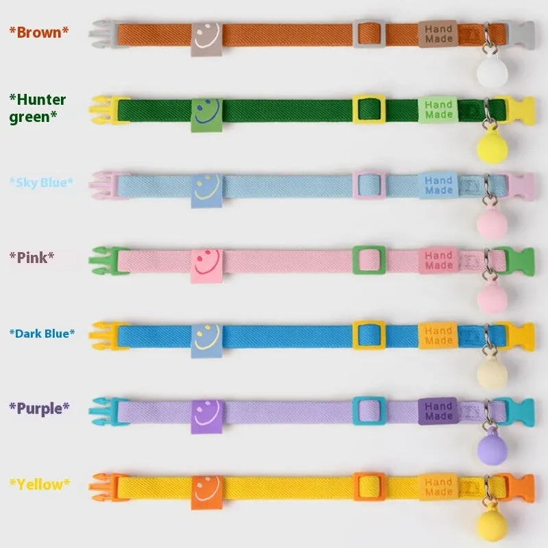 Small dog elastic polyester pet collar in multiple colours on a white background